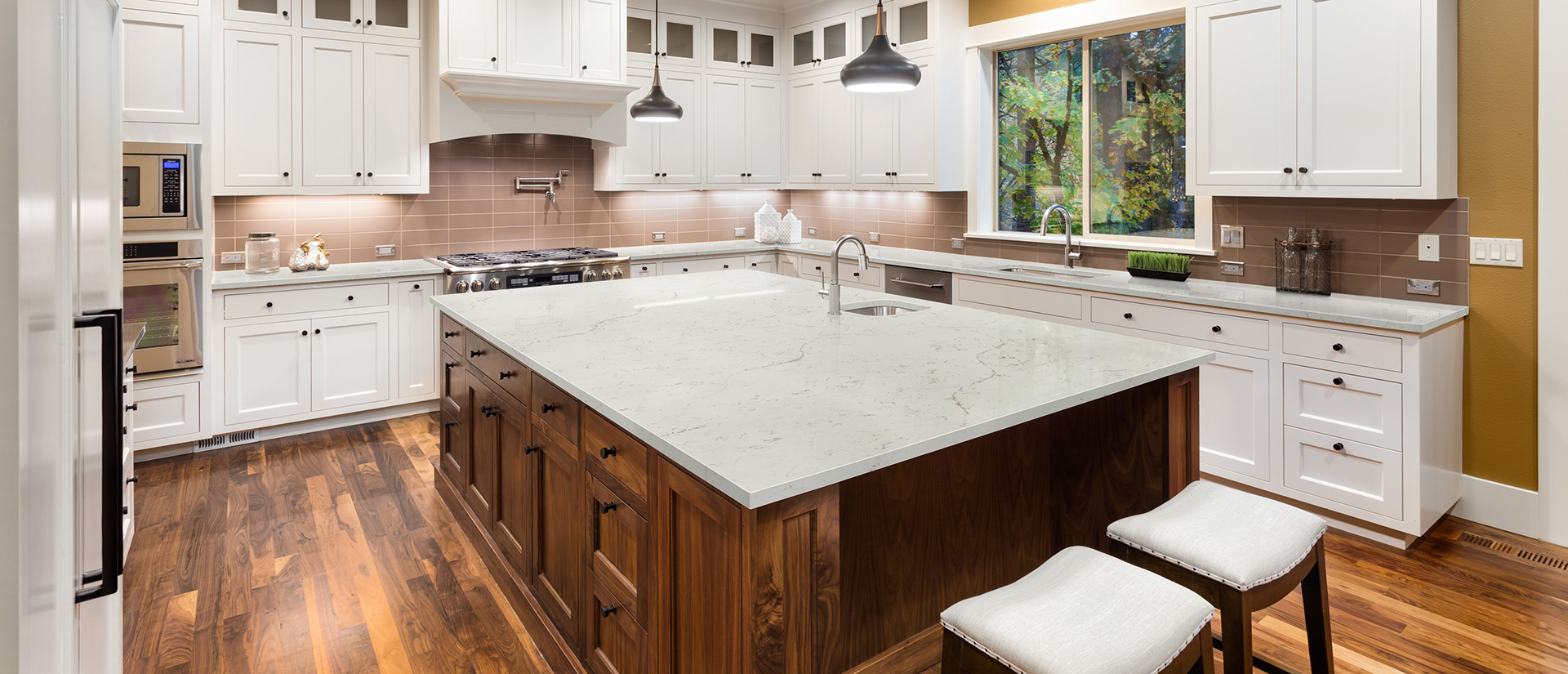 Calacatta Lavasa quartz countertop in a luxurious kitchen with marble backsplash
