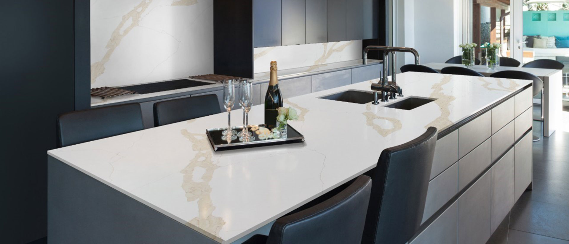 Calacatta Leon Gold quartz countertop in a luxurious kitchen with marble backsplash