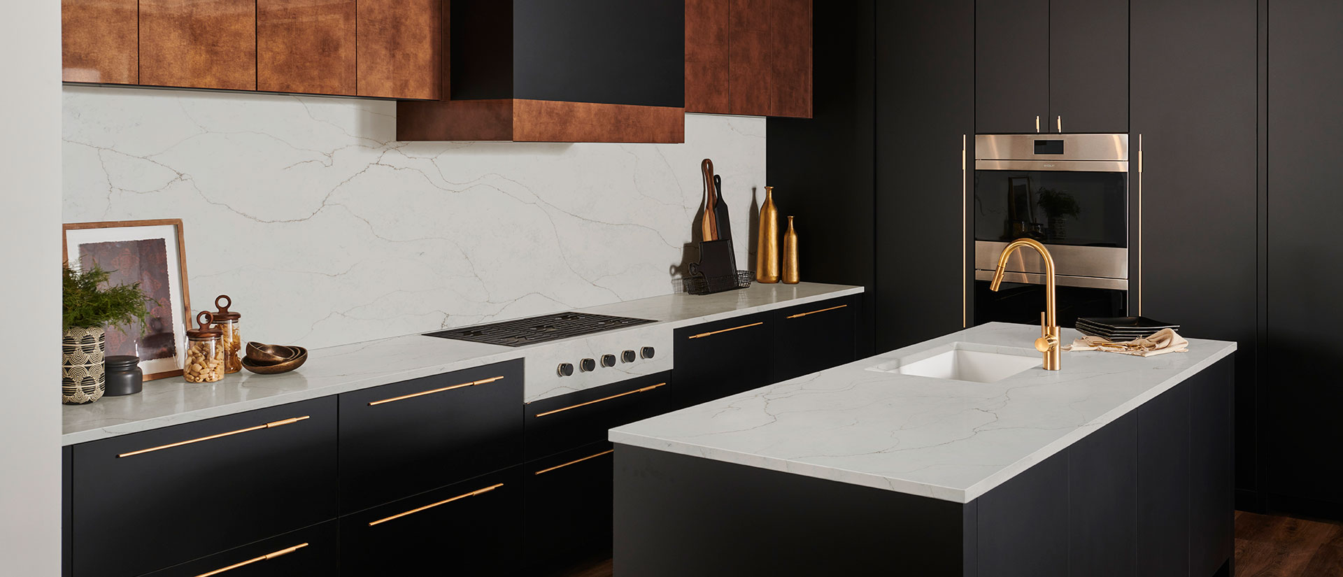 Calacatta Prado quartz countertop in a luxurious kitchen with marble backsplash