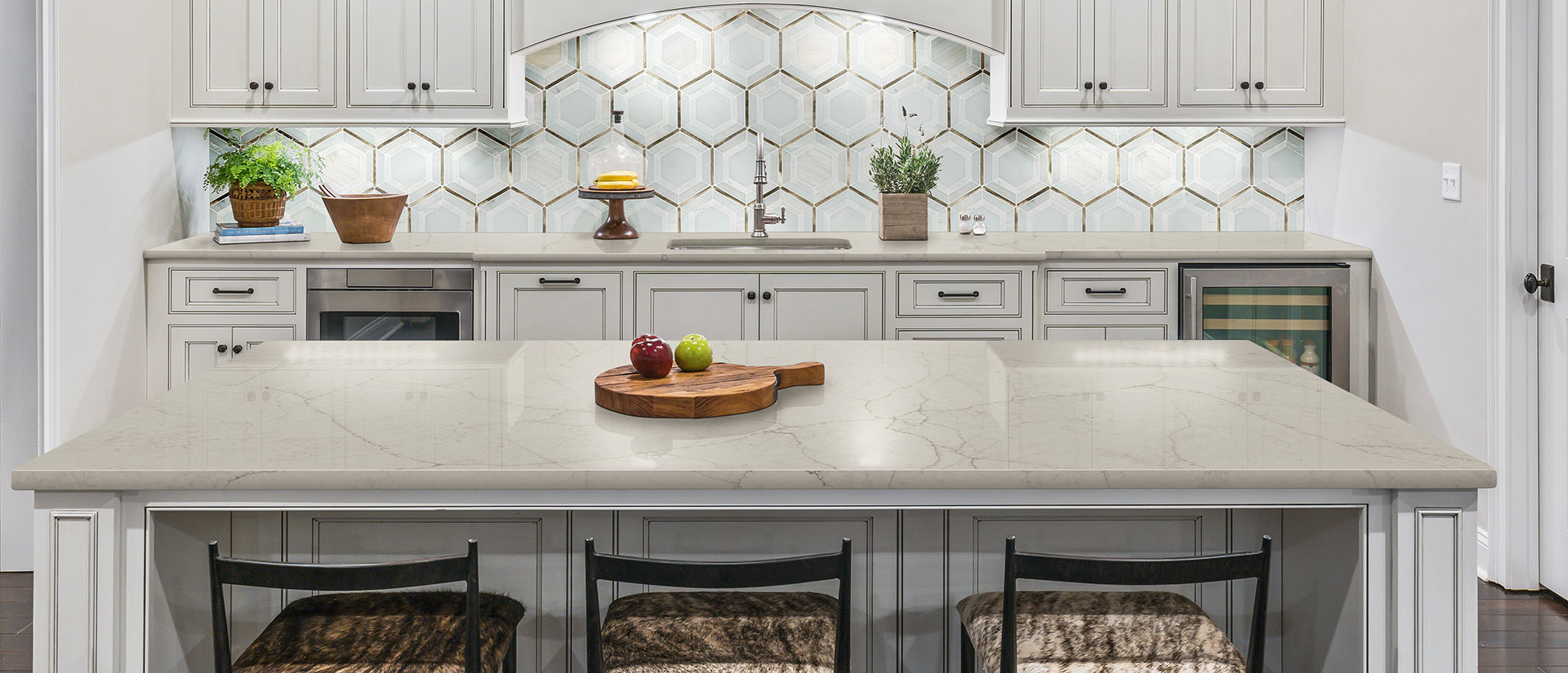 Calacatta Valentin quartz countertop in a luxurious kitchen with marble backsplash