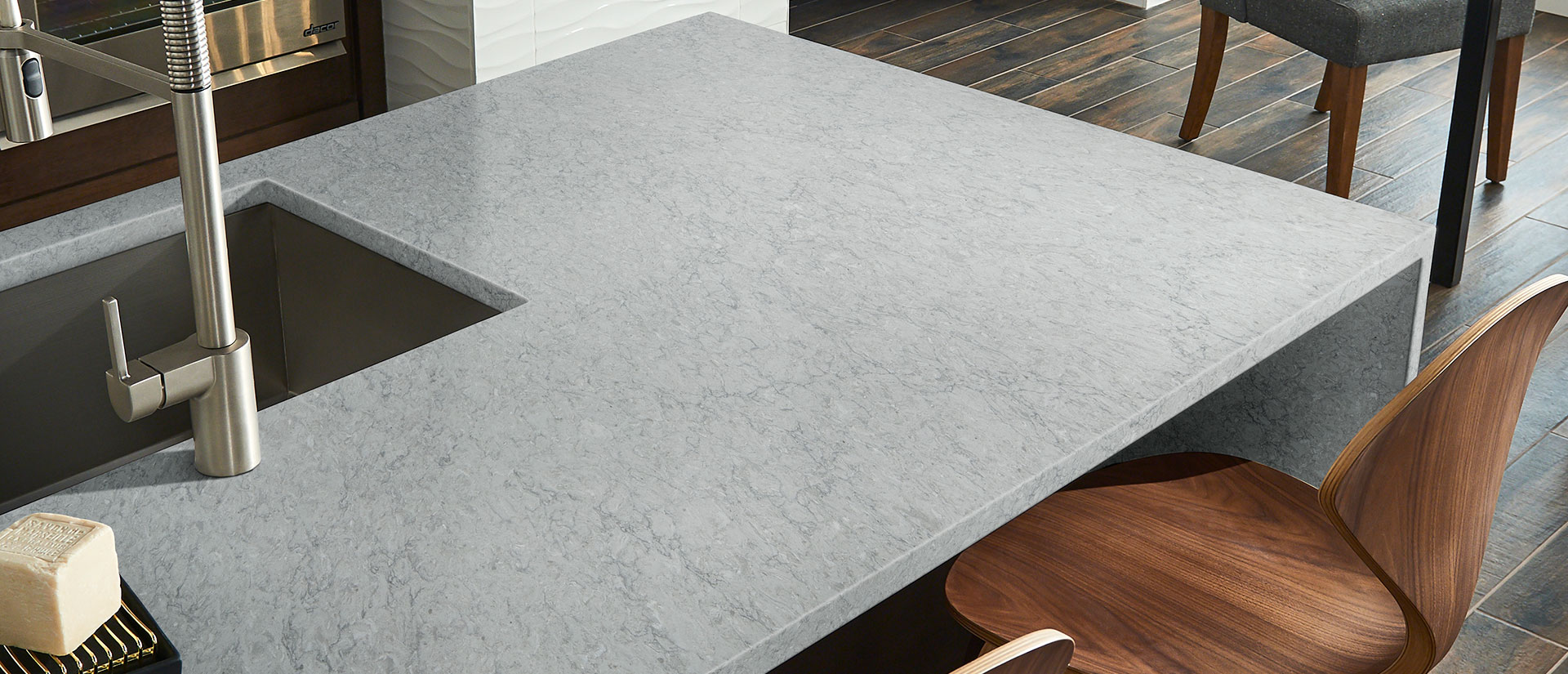 Galant Gray Quartz countertop in a contemporary kitchen with warm wood accents