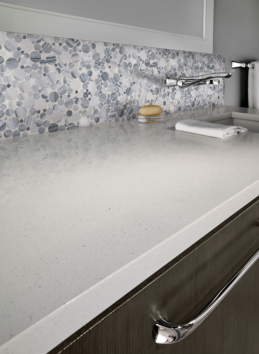 Alaska Gray Pebble Polished Tile backsplash in kitchen