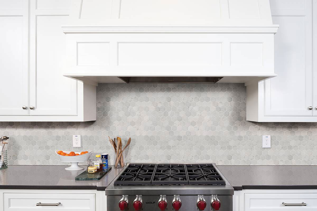 Carrara White Polished 2" Hexagon Mosaic Tile backsplash in kitchen