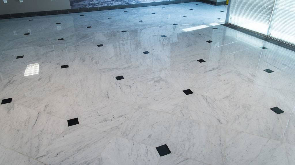 White Carrara Marble Tile Floor in Hall