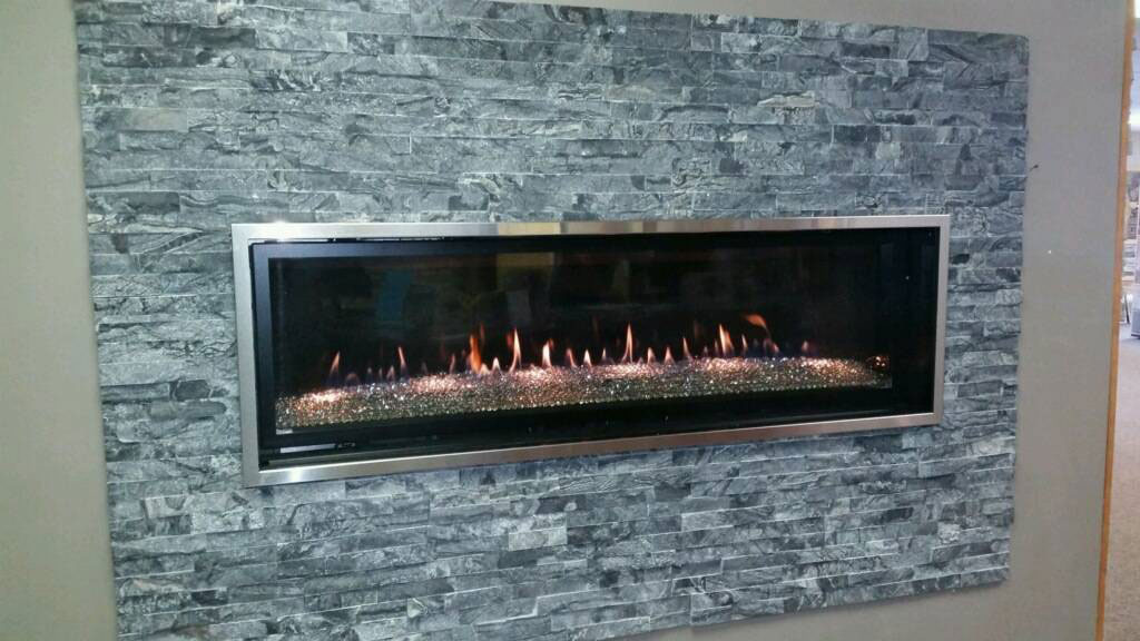 Glacial Black Stacked Stone wall near fireplace