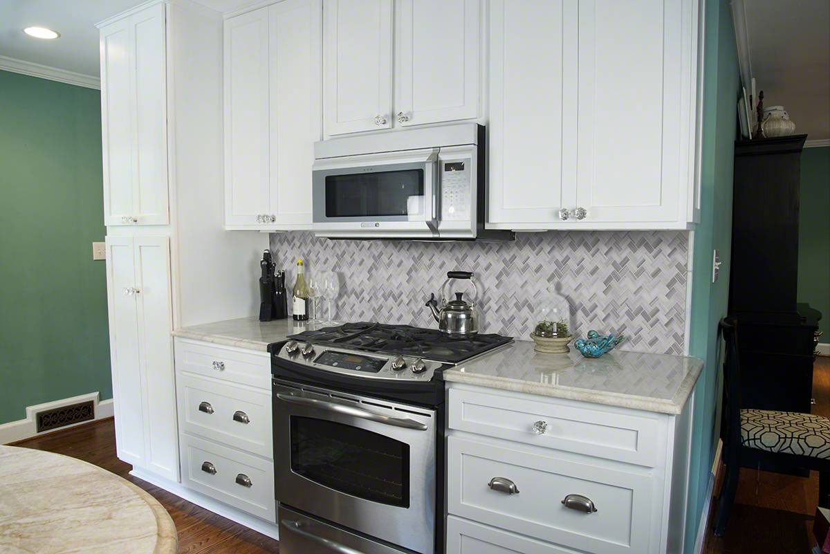 Greecian White Herringbone Pattern Tile backsplash in kitchen