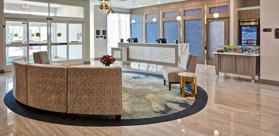 Hospitality flooring in hotel lobby Pietra Venata White Room Scene