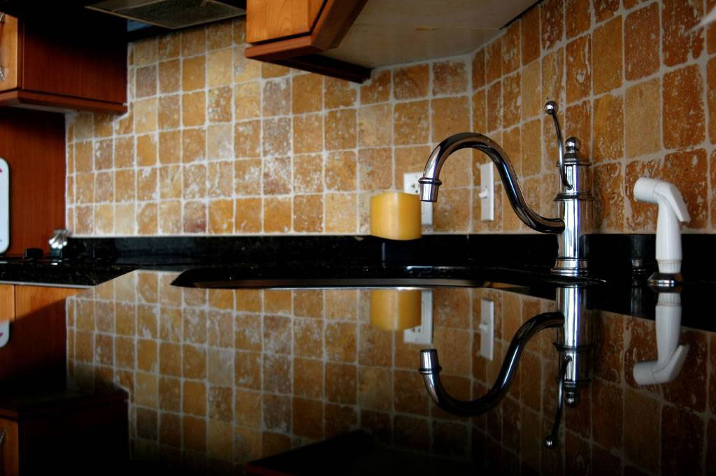 Premium Black Granite and Tuscany Gold 4x4 Tumbled Tile Room Scene