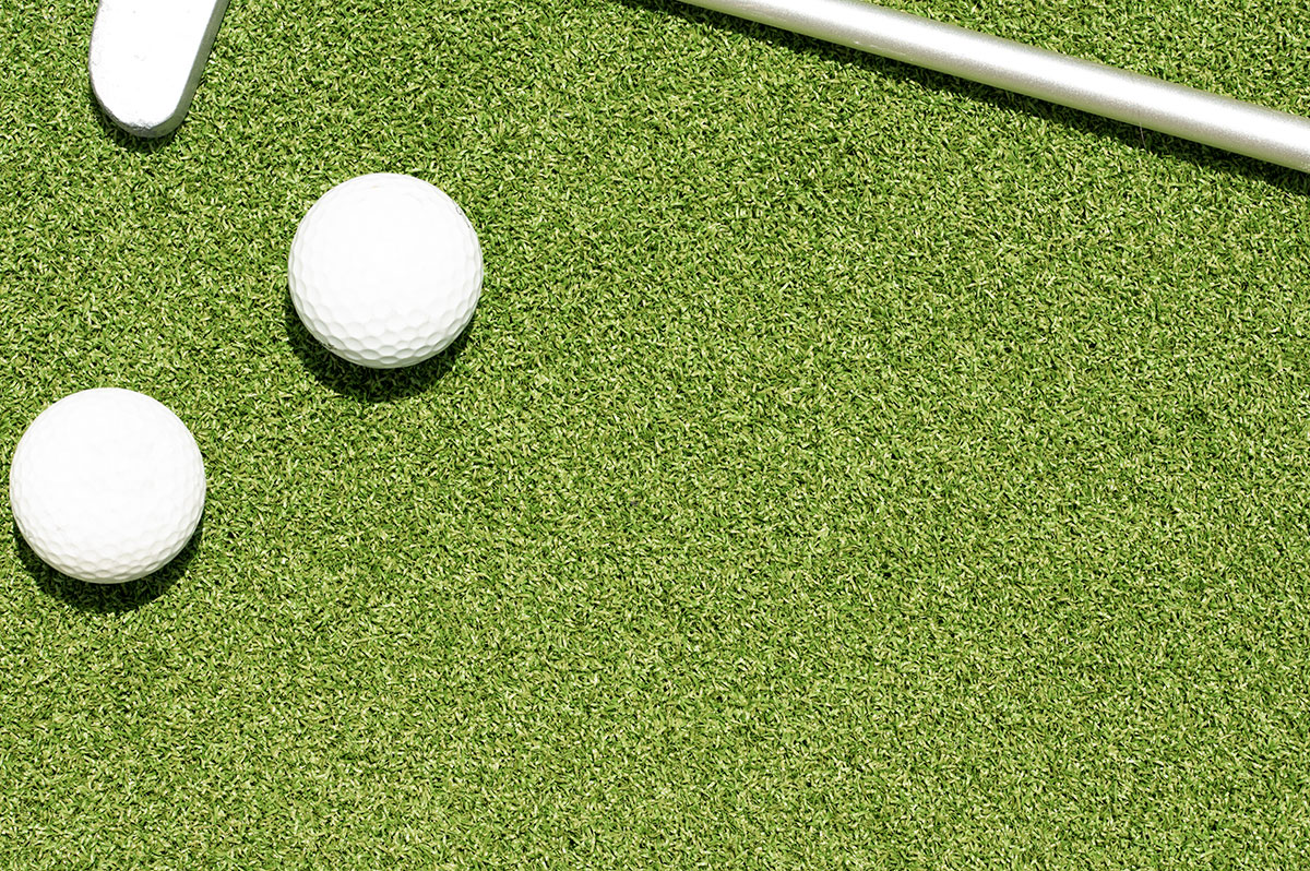 Evergrass™ Putting Green Turf 78 closeup of lawn, putter and golf balls