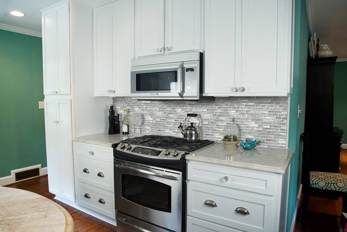 Silver Canvas Interlocking Tile backsplash in kitchen