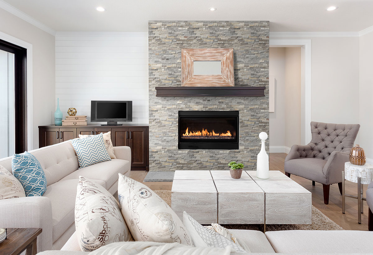 Sunset Silver Stacked Stone wall near fireplace