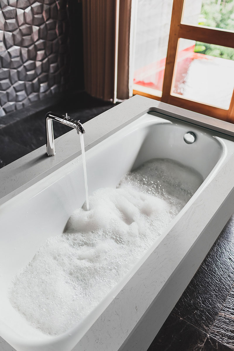 Vanilla Sky Engineered Marble Adjacent to Bathtub in Bathroom