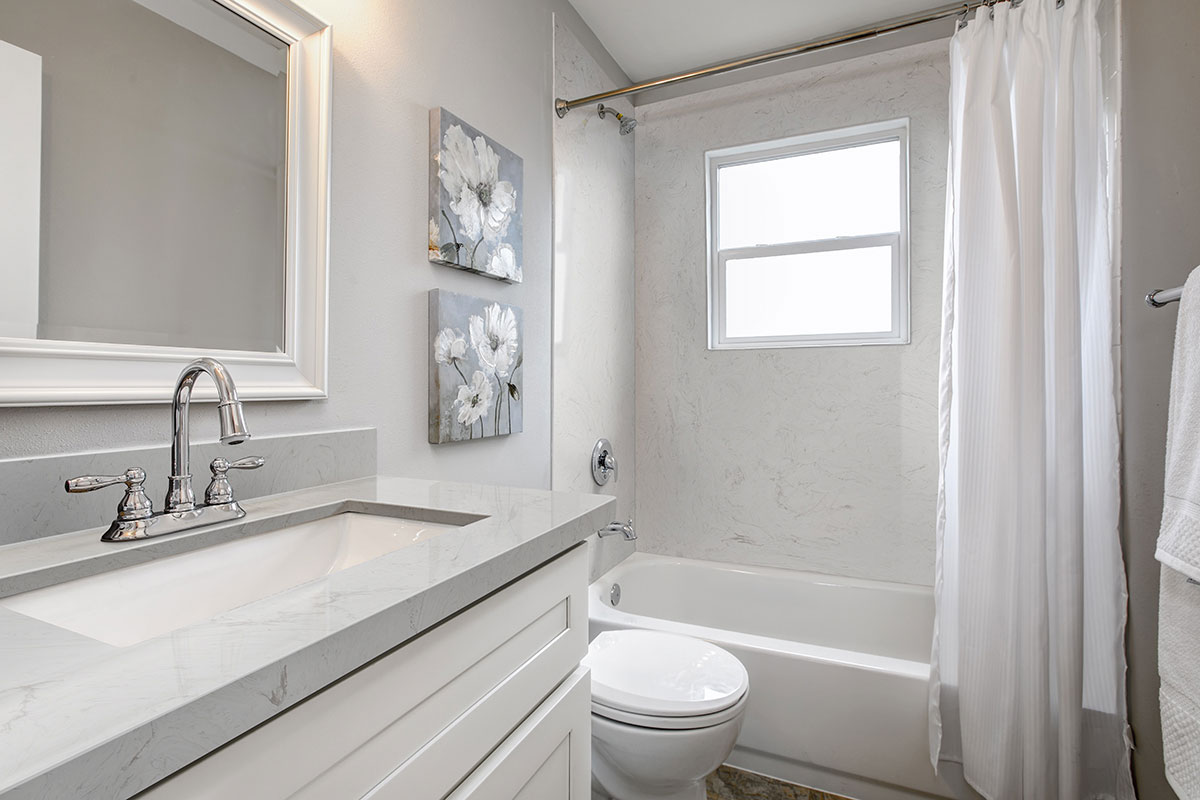 Vanilla Sky Engineered Marble Countertop and Bathtub Wall in Bathroom