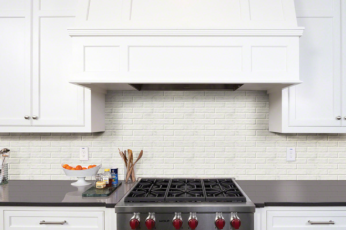 Brickstone White 2x10 Brick Tile accent wall in kitchen