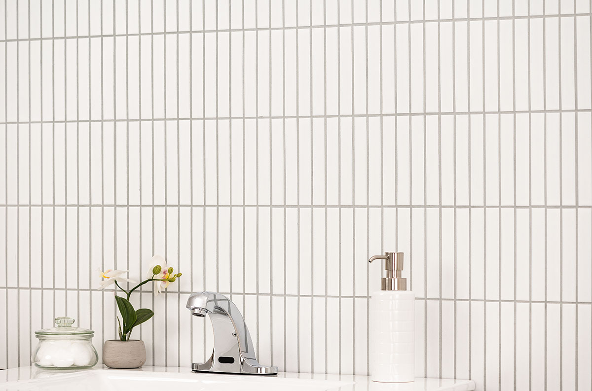 White Matte 1x6 Stack Pattern wall in bathroom