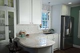 Arabescato Carrara Herringbone Pattern backsplash tile in kitchen