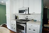 Arabescato Carrara Herringbone Pattern backsplash tile in kitchen