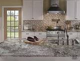 Arctic Storm 0.625x2 Brick Pattern wall Tile with Alaska White Granite countertop in kitchen