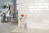 Renzo Dove Ceramic Tile 3x12 wall in bathroom