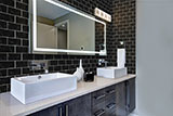 Nero Marquina 3X6 Glass Tile wall in bathroom