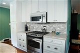 Silver Canvas Interlocking Tile backsplash in kitchen